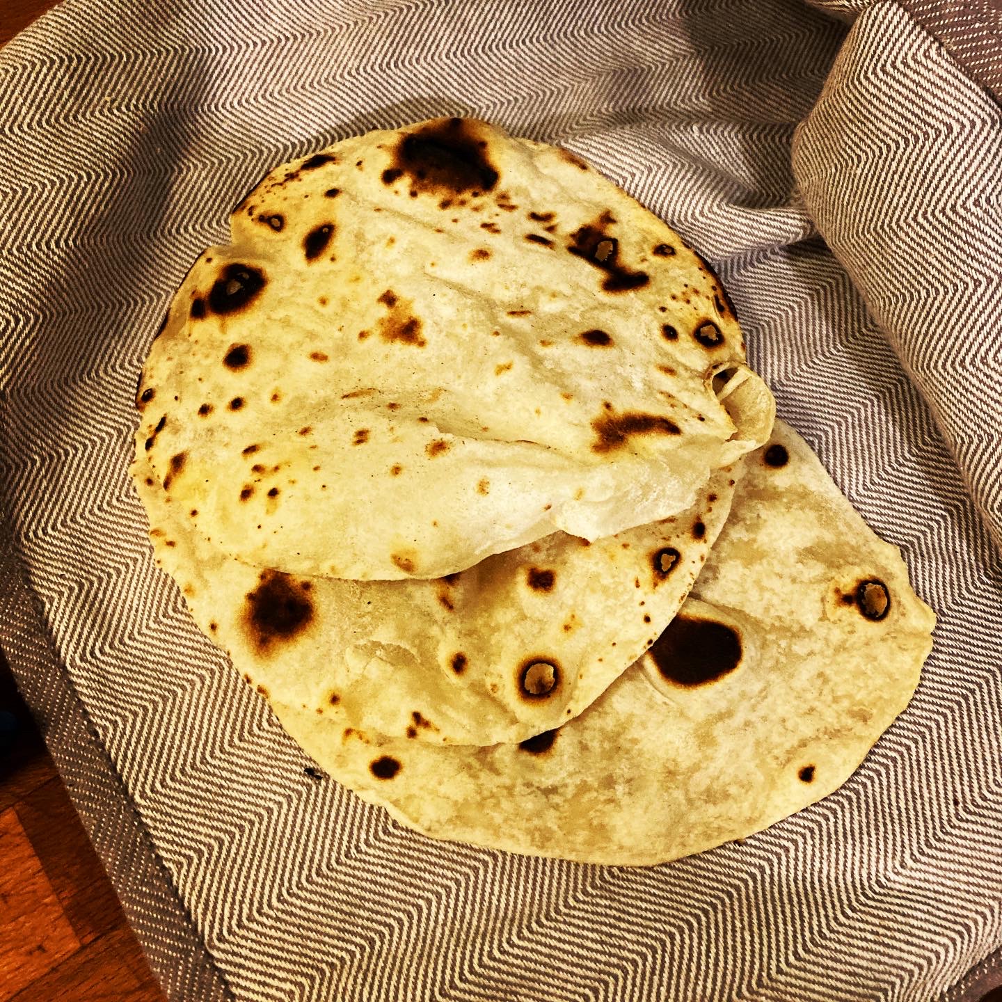 flour tortillas in a kitchen towel